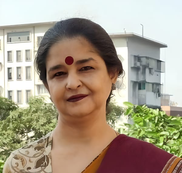 Woman wearing sari with red bindi outdoors
