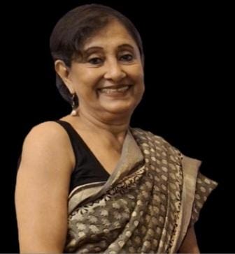 Smiling woman wearing a patterned sari