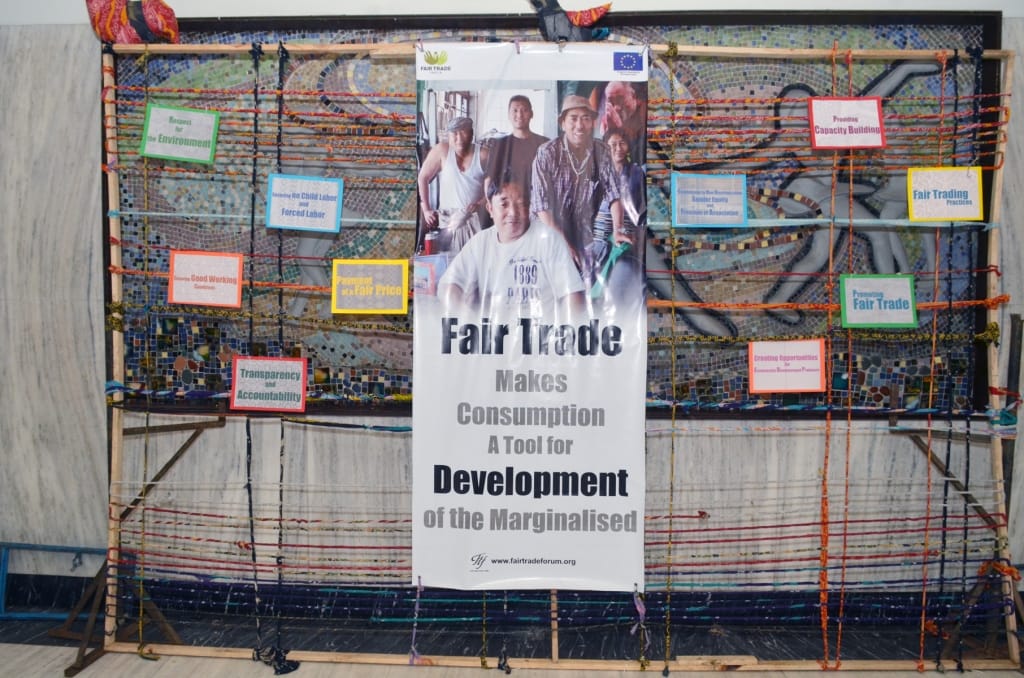 Fair Trade banner with colorful educational display